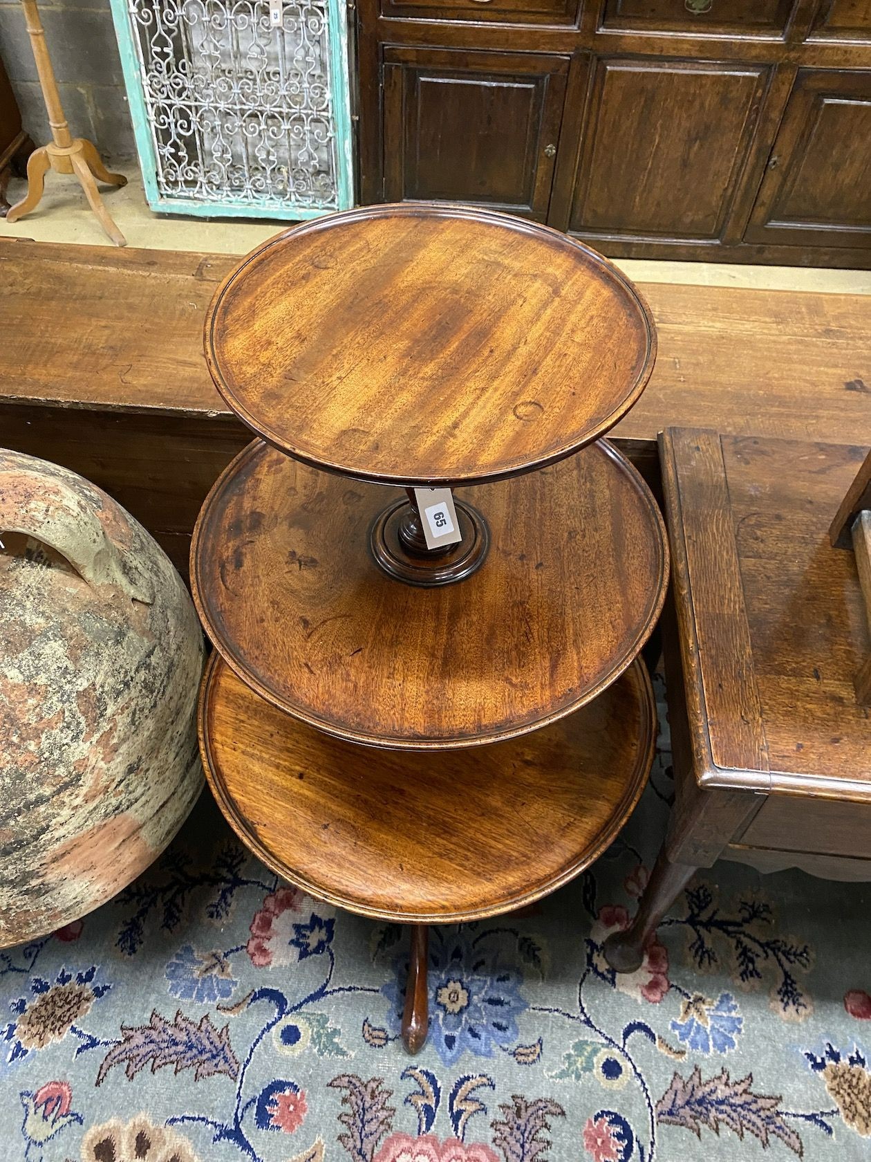 A George III mahogany three tier dumb waiter, height 108cm